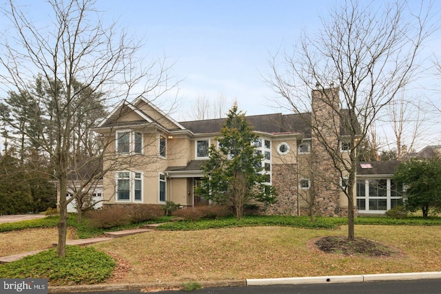 130 Wedgewood Ln, Haddonfield, NJ 08033 - view of front of house with a chimney, a front yard, and stucco siding