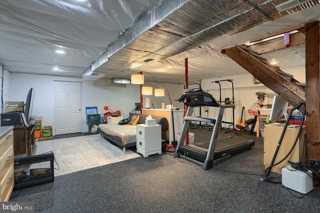 workout area with concrete block wall