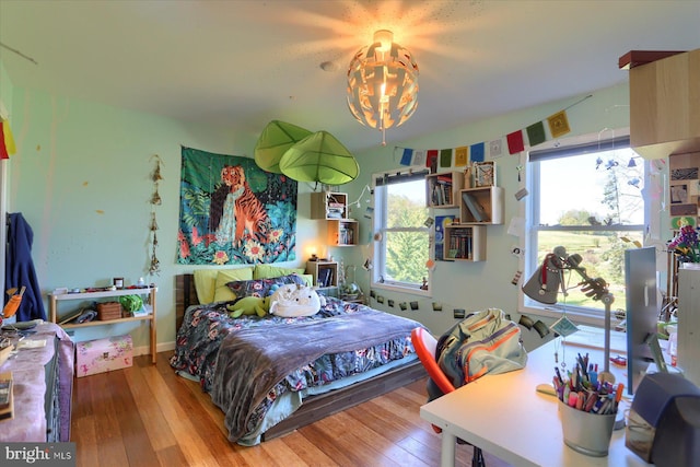 bedroom with hardwood / wood-style flooring