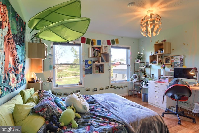 bedroom featuring wood finished floors