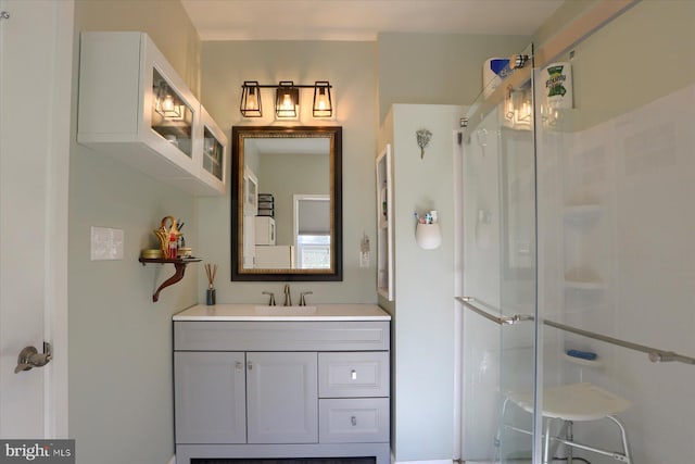 bathroom featuring a stall shower and vanity