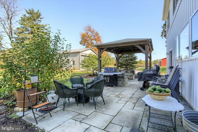 view of patio / terrace featuring a grill and a gazebo