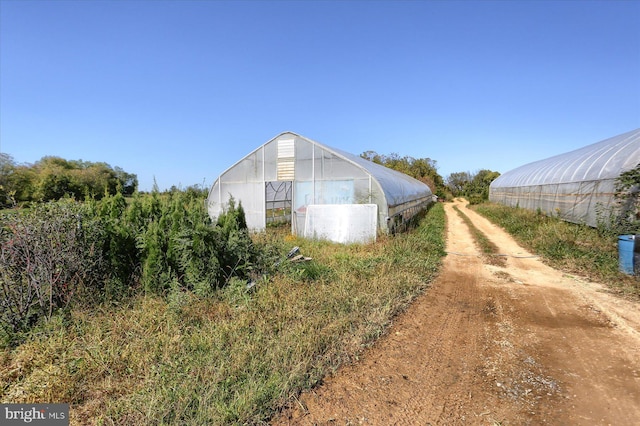 exterior space featuring an outbuilding and an exterior structure