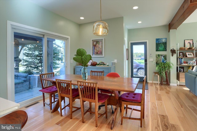 dining room with light wood finished floors, baseboards, visible vents, beam ceiling, and recessed lighting