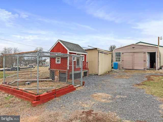 view of shed featuring driveway