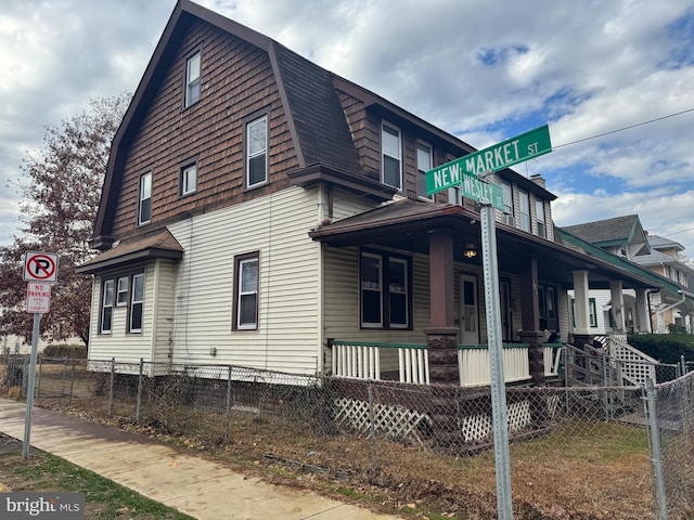 view of side of home with a porch