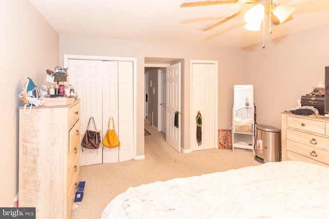 bedroom featuring light carpet and ceiling fan