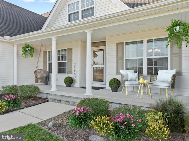 view of exterior entry featuring a porch