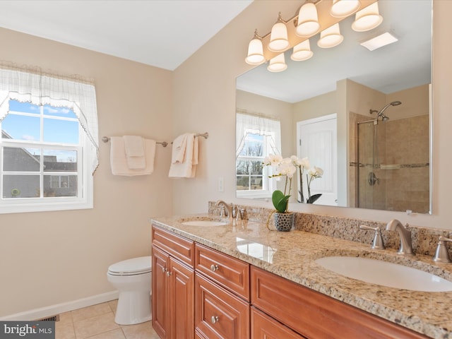 bathroom with vanity, tile patterned floors, a shower with door, and toilet