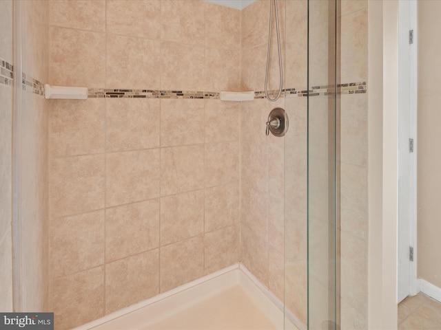 bathroom with tiled shower