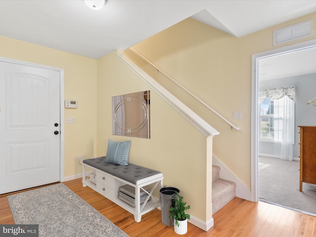 foyer entrance featuring hardwood / wood-style floors