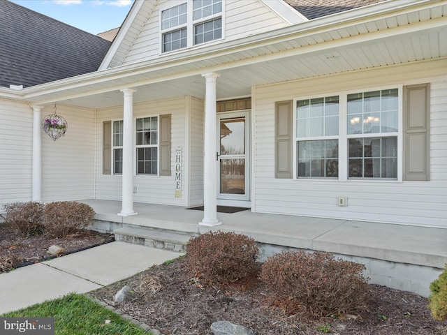 entrance to property featuring a porch