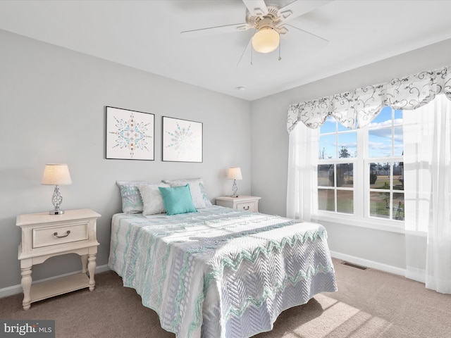 carpeted bedroom with ceiling fan