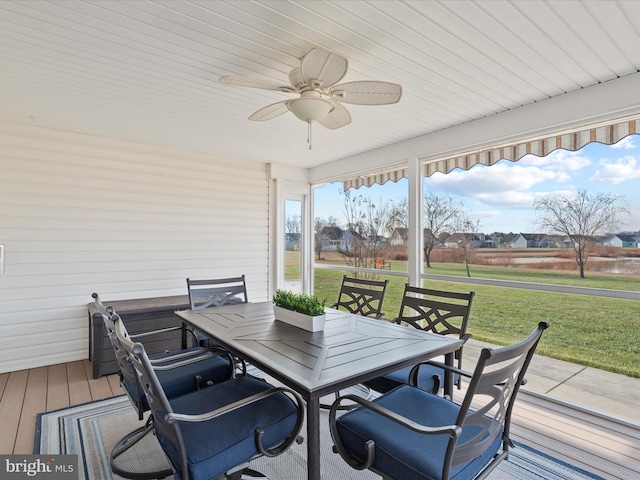 deck with ceiling fan and a lawn