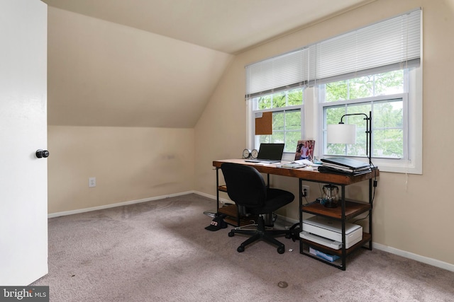 home office featuring carpet and lofted ceiling