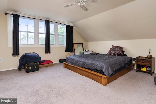 carpeted bedroom featuring ceiling fan and lofted ceiling