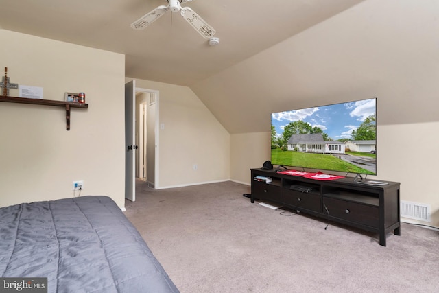 bedroom featuring ceiling fan, light colored carpet, and vaulted ceiling