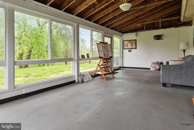 unfurnished sunroom featuring lofted ceiling