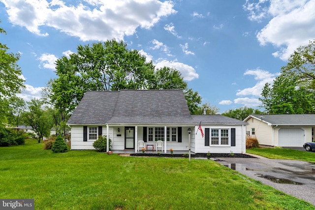 ranch-style home with covered porch and a front yard