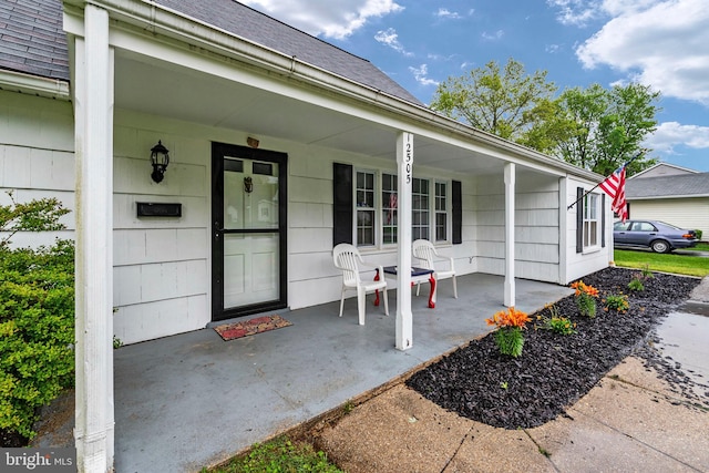 doorway to property featuring covered porch