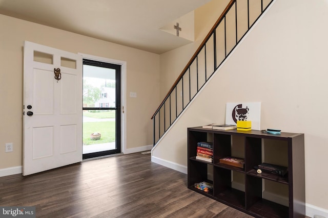 foyer with dark hardwood / wood-style flooring