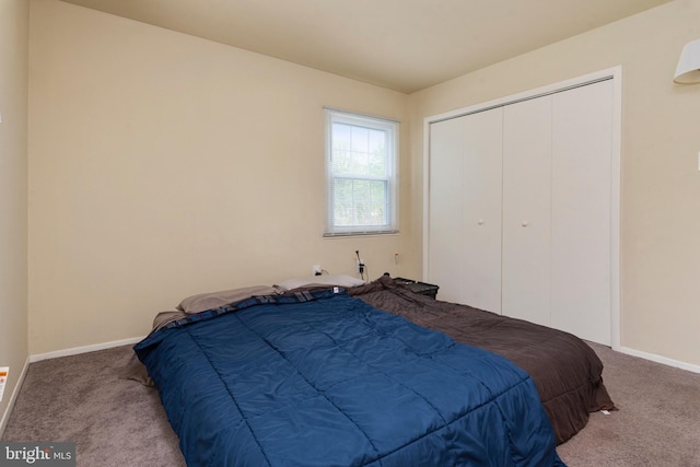 carpeted bedroom with a closet