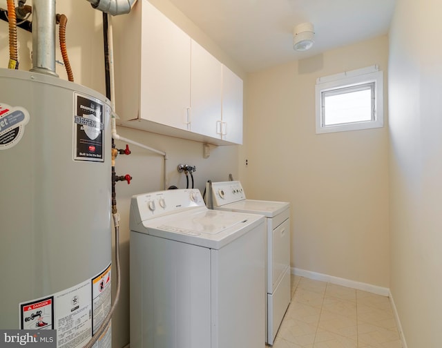 laundry room with washer and dryer, cabinets, light tile patterned floors, and water heater