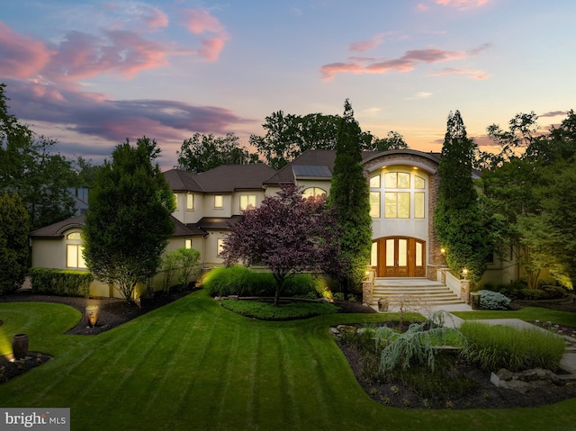 view of front of home with a yard