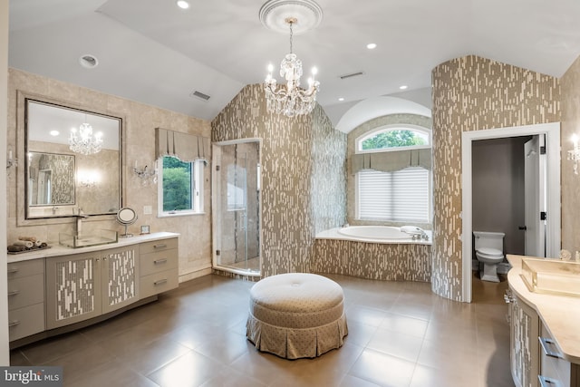 full bathroom featuring a notable chandelier, separate shower and tub, toilet, and vaulted ceiling