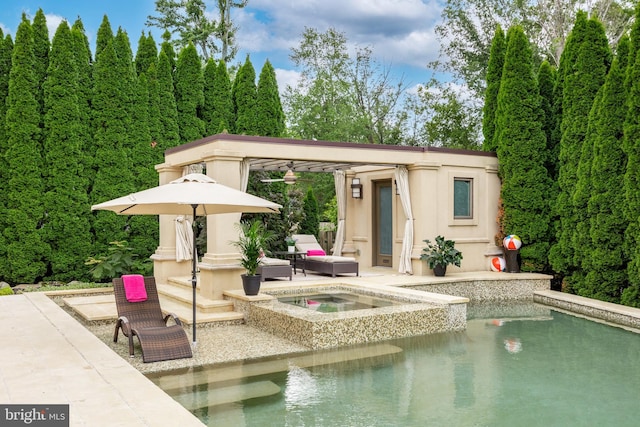 view of pool with an in ground hot tub and a patio