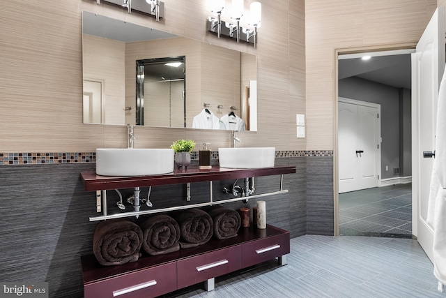 bathroom featuring tile patterned floors, vanity, and tile walls