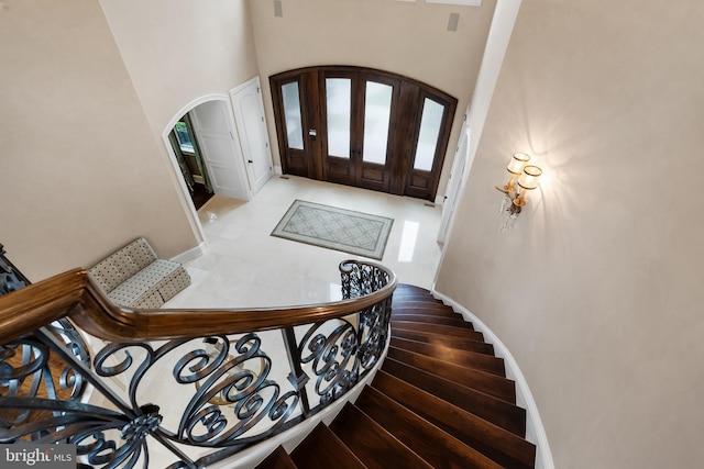 entrance foyer with a towering ceiling