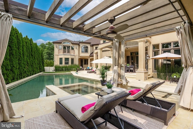 view of pool with ceiling fan, an in ground hot tub, a pergola, and a patio