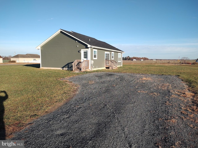 view of property exterior featuring a yard