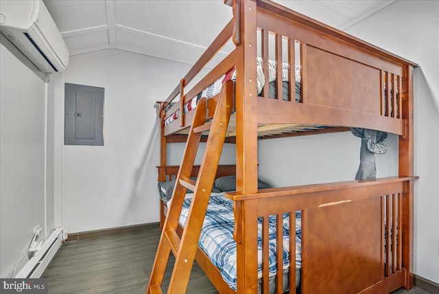 bedroom with dark hardwood / wood-style floors, a baseboard heating unit, a wall unit AC, electric panel, and vaulted ceiling