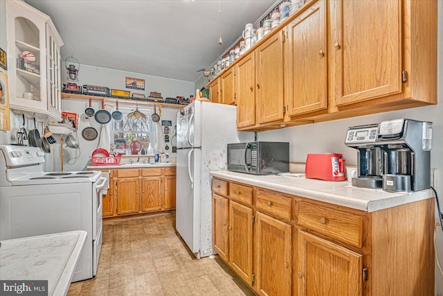 kitchen with white appliances and sink