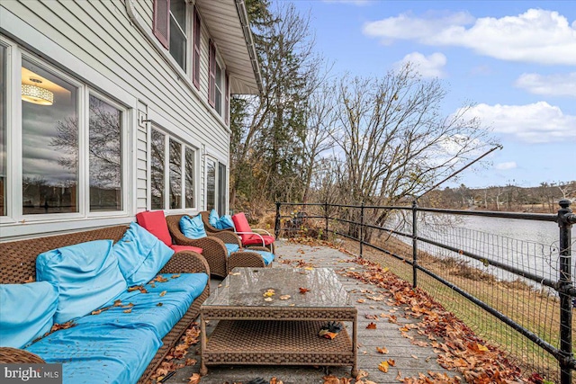 view of patio / terrace with outdoor lounge area and a water view