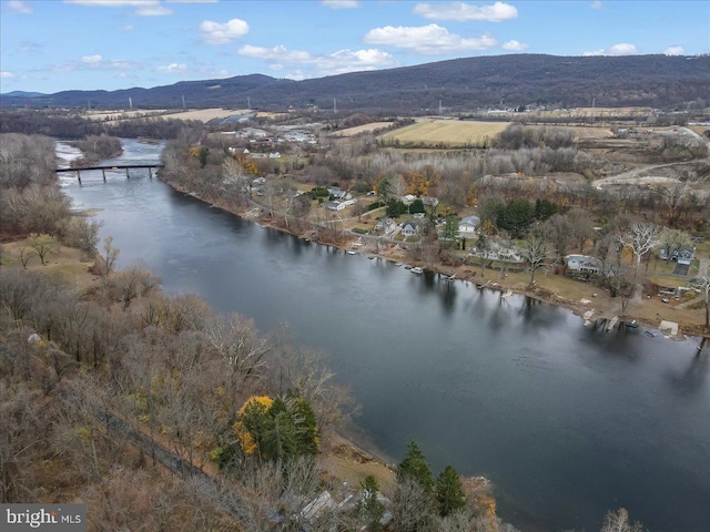 bird's eye view with a water and mountain view