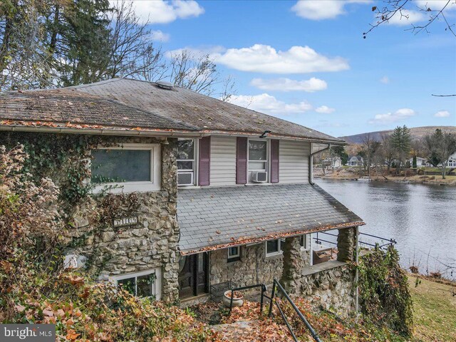 5449 Depues Rd, Bangor, PA 18013 - view of front of home with stone siding, a water view, cooling unit, and a high end roof