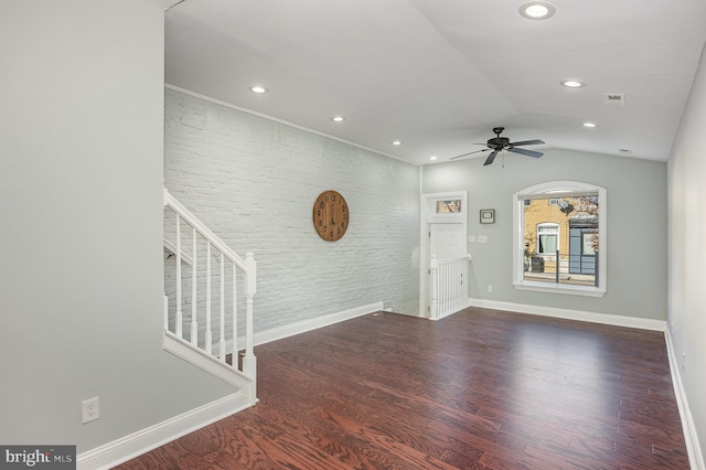 unfurnished living room with vaulted ceiling, ceiling fan, and dark hardwood / wood-style floors