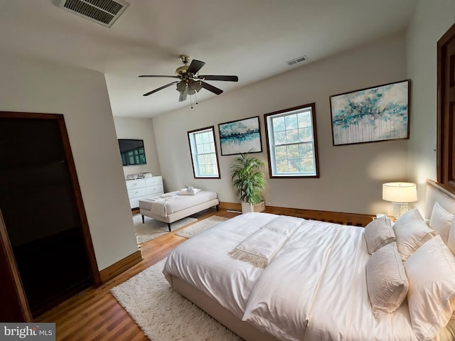 bedroom featuring ceiling fan and hardwood / wood-style floors