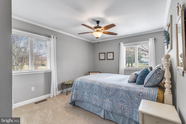 bedroom with ceiling fan, ornamental molding, and light carpet