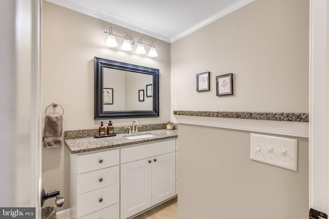 bathroom with vanity and ornamental molding