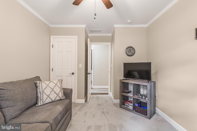 living room with ceiling fan, crown molding, and light carpet