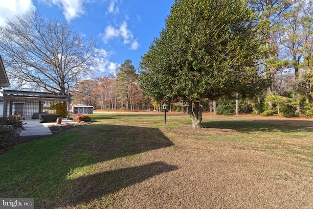 view of yard with a pergola and a patio