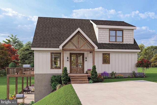 view of front facade featuring a front yard and french doors