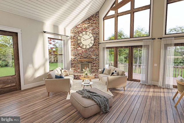 sunroom featuring a fireplace, vaulted ceiling, and a healthy amount of sunlight