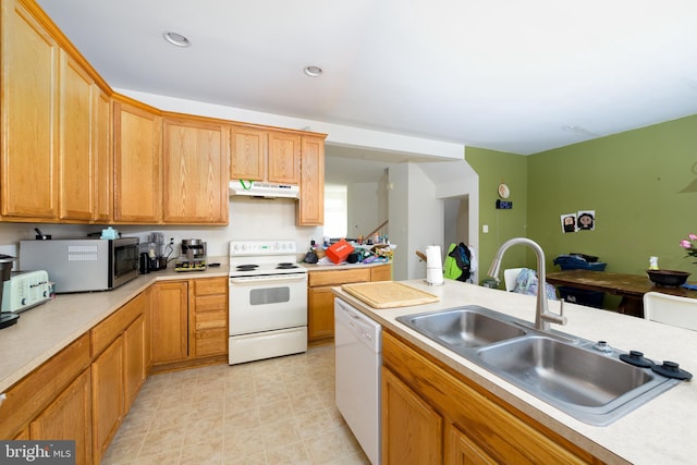 kitchen featuring white appliances and sink