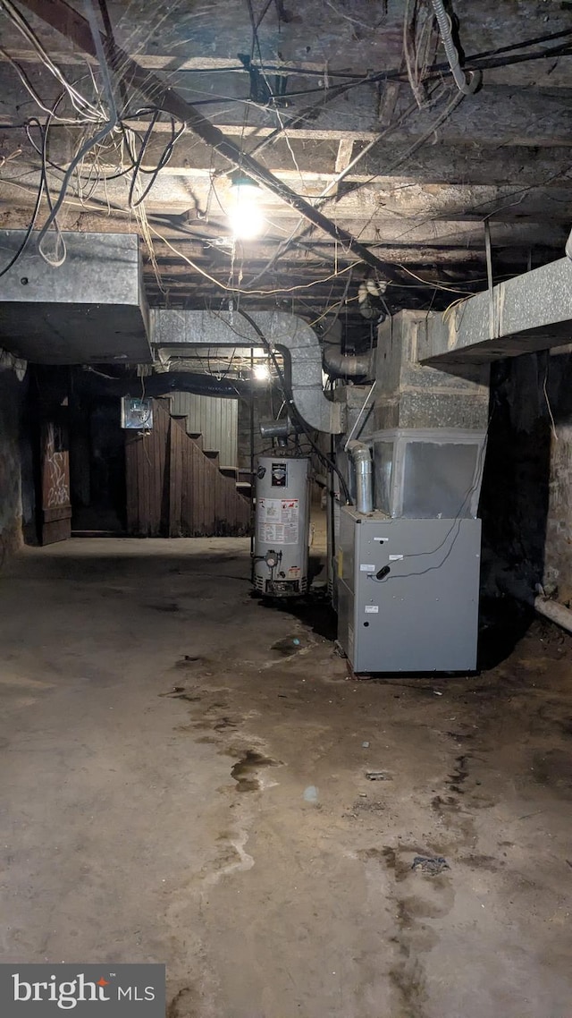 basement with heating unit and water heater