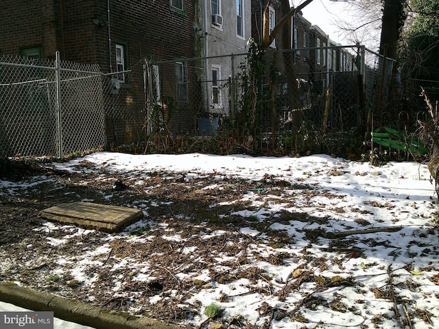 view of yard layered in snow